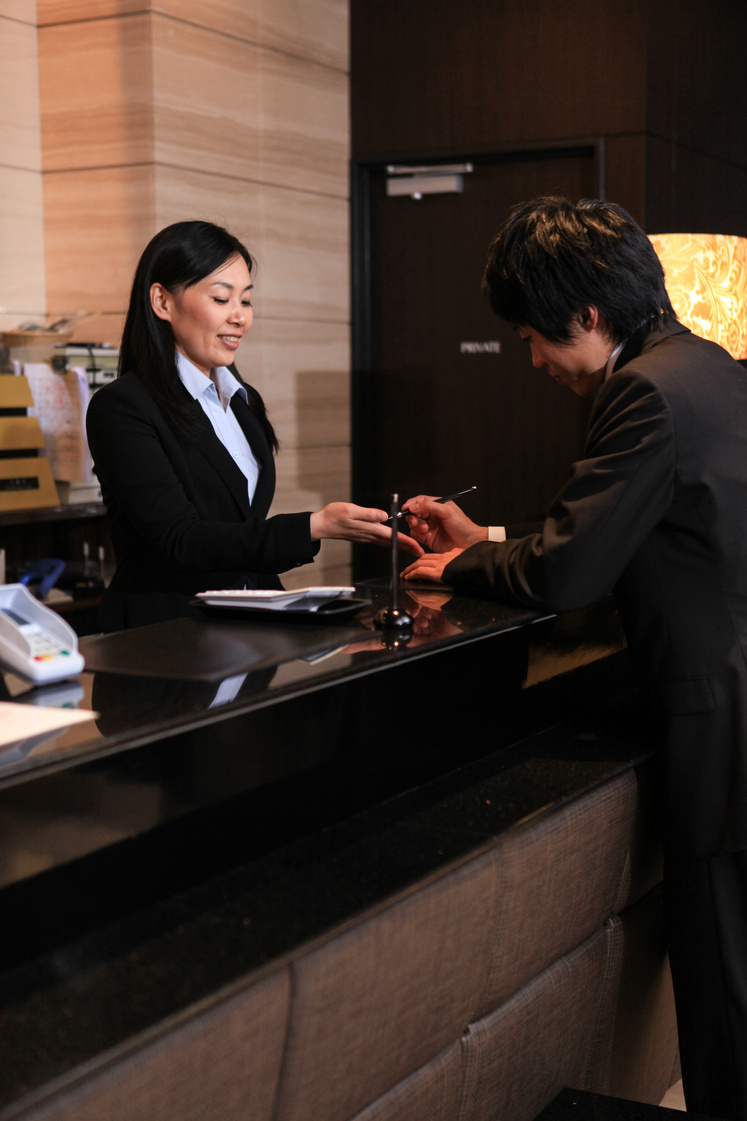 Businessman check-in Hotel Reception in Tokyo